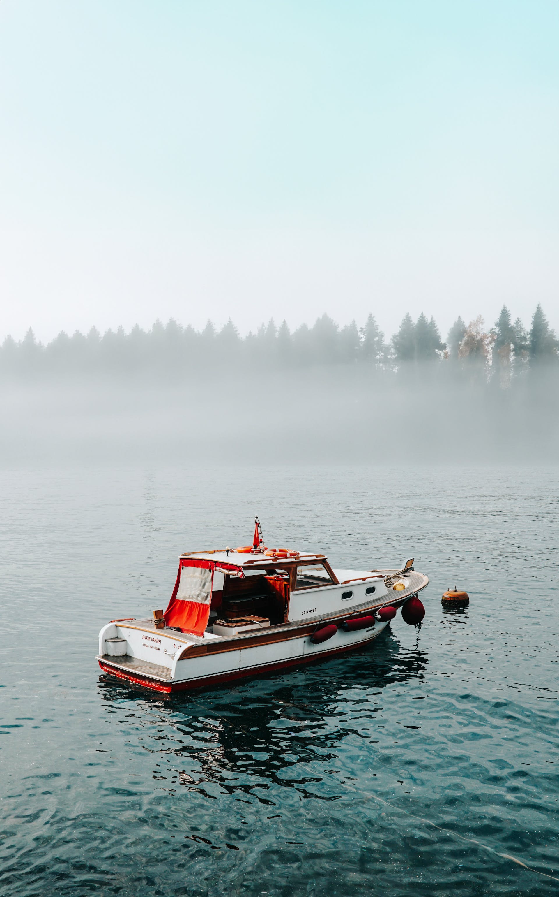 Motorboat on Lake under Fog